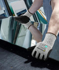Individual wearing A3 Cut Resistant Work Gloves For Men And Women Foam Nitrile Coated With Touchscreen Friendly Tips handling glass.