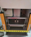 Workhorse Benchtop Pneumatic Press With Foot Pedal For Hands Free Operation, Dual Safety Light Curtains, And Adjustable Dwell Timer For Blister Packaging, Stamping, Riveting, And Component Assembly front view with safety sensors and press plate