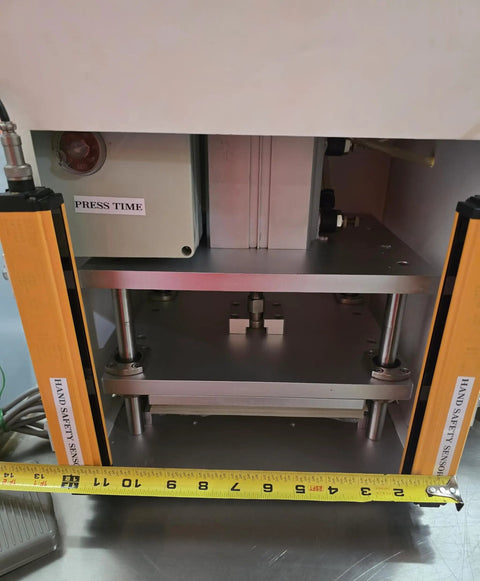 Workhorse Benchtop Pneumatic Press With Foot Pedal For Hands Free Operation, Dual Safety Light Curtains, And Adjustable Dwell Timer For Blister Packaging, Stamping, Riveting, And Component Assembly front view with safety sensors and press plate