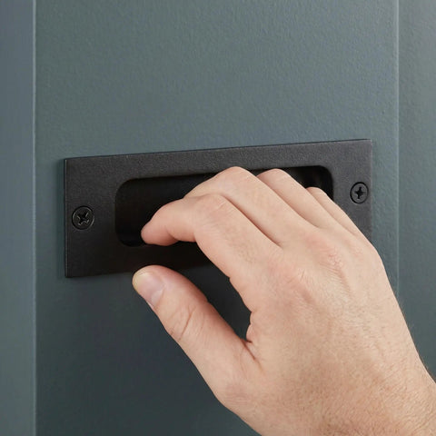 Hand using Two Pack Recessed Finger Flush Door Pulls For Pocket And Sliding Barn Doors Black Stainless Steel Rectangular Door Handles