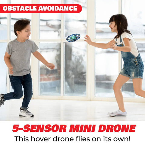 Kids playing with Hand Operated Scoot Drone For Kids And Adults With Hands Free Motion Sensor LED Indoor UFO Toy Rechargeable Flying Orb Ball Drone For Boys And Girls Blue Easy Toss To Launch And Hover For Beginners indoors.