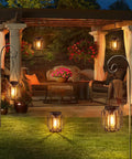 Outdoor Solar Lanterns Pack Of 4 Waterproof Metal Hanging Lights illuminating a garden patio area at night
