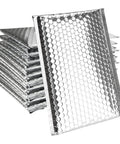Stack of metallic bubble mailers 75 pack 6 by 9 inch padded envelopes with self seal foil bags for mailing packing shipping.