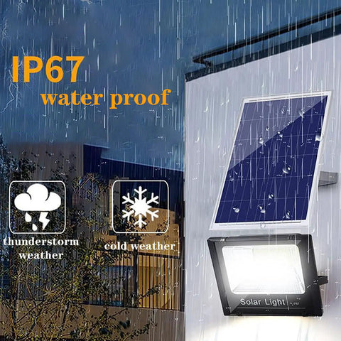 JUDYSSY Solar Flood Light60W100W200W, waterproof design showcased in rain, highlighting solar panel and LED light for outdoor use.