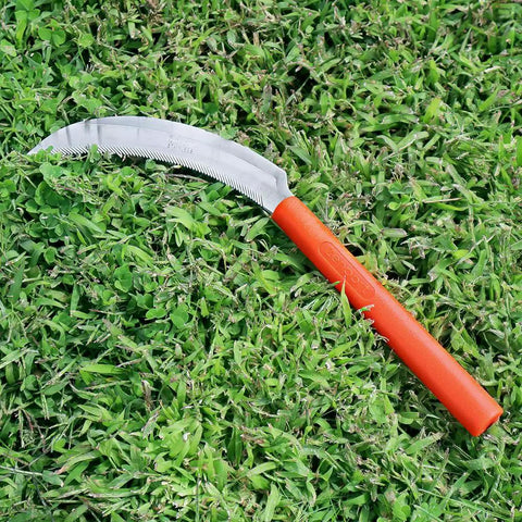 K208P Easy Grab And Go Harvest Sickle With Plastic Handle And Light Serration, lying on grass