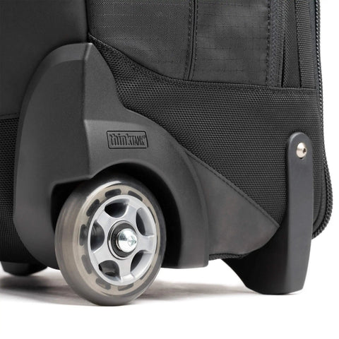 Close-up of smooth rolling wheels on Walker Pro Rolling Camera Backpack for photography gear and video equipment.