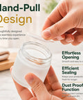 Hand pulling lid off a frosted glass jar from Score 16 Fresh 2 Oz Frosted Glass Sample Jars With Sleek Rose Gold Screw Caps.