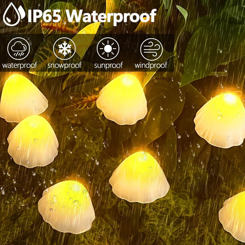 Two Pack 32 LED Mushroom Solar String Lights, 55 Ft Outdoor Waterproof Garden Decoration With 8 Lighting Modes glowing in rain
