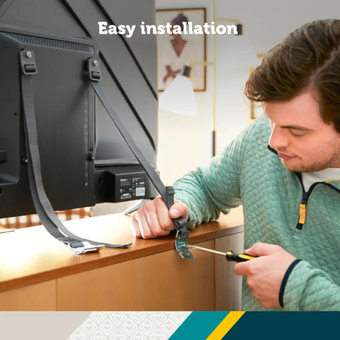 Man installing TV And Furniture Safety Straps 53 Inch Long Universal Mounting Straps For TVs To Wall Or Furniture 2 Pack