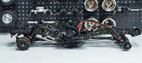 Side view of Gold Rush V2 Carbon Fiber LCG Chassis Kit For Axial SCX10 II Capra 1.9 UTB And Other DIY One Tenth RC Crawlers With Lightweight Aluminum Alloy POM Construction For Beefier Strength And Performance And Custom Builds, showcasing its carbon fiber and aluminum components.