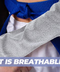 Tough As Nails Cut Resistant Arm Sleeve With Snug Elastic Fit For Men And Women Breathable Forearm Guard shown close-up on a hand.