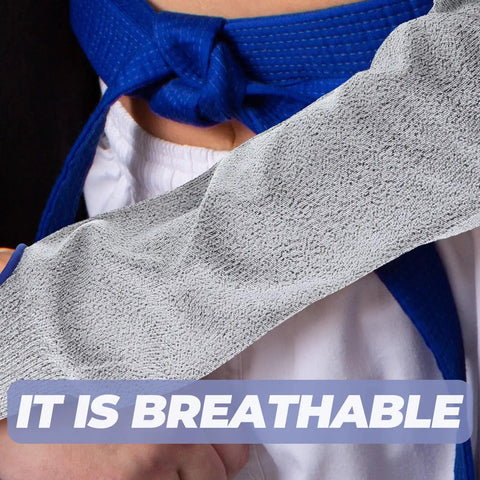 Tough As Nails Cut Resistant Arm Sleeve With Snug Elastic Fit For Men And Women Breathable Forearm Guard shown close-up on a hand.