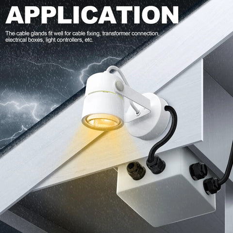 White outdoor wall-mounted spotlight with weatherproof junction box and black cable glands.