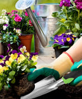 Gardener using Heavy Duty Cast Aluminum Garden Hand Shovel And Trowel for planting flowers in soil, surrounded by blooming plants.
