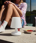 Tiny Rechargeable LED Lamp 2.0 Go Anywhere Dimmable Table Light with woman, outdoor scene