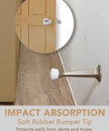 Image of 5 Pack 3 Inch Heavy Duty Solid Door Stop with Zinc Die Cast Body and Soft Bumper Tips Silver Finish installed on wall.