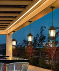 Patio with 7.5 Inch Outdoor Pendant Light For Porch Modern Black Die-Cast Aluminum Fixture With Ripple Glass under a pergola