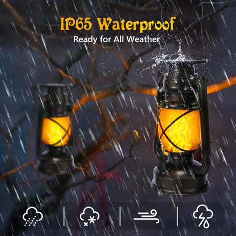 Bronze Vintage Solar Lanterns Two Pack Outdoor Lights with LED in rain showcasing waterproof feature, hanging on tree.