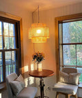 Handcrafted Rattan Plug In Pendant Light Featuring Smooth Dimmable Switch And Handwoven Wicker Bamboo Shade in cozy corner.