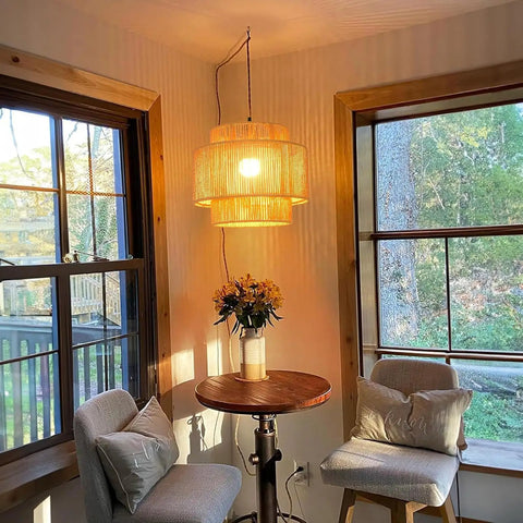 Handcrafted Rattan Plug In Pendant Light Featuring Smooth Dimmable Switch And Handwoven Wicker Bamboo Shade in cozy corner.