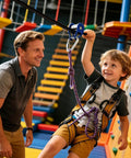 Child using Aluminum Zip Line Kit With Heavy Duty Pulleys And Quick Setup Trolley Slider For Backyard Or Park, assisted by an adult.