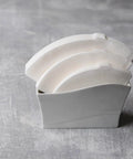 V60 Cone Pour Over Coffee Filters Size 02 White 600 Count Unbleached Single Use Paper Filters displayed in a holder