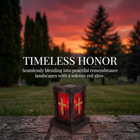Memorial lantern with red glow and cross design in a sunset graveyard landscape