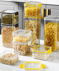 Straight Up Solid Game Changer For Your Kitchen Pantry Clear Airtight Glass Coffee Jar With Matching Spoon And Stand Sealed Food Container For Spices Or Grains stacked jars with yellow lids holding grains and pasta on a kitchen counter