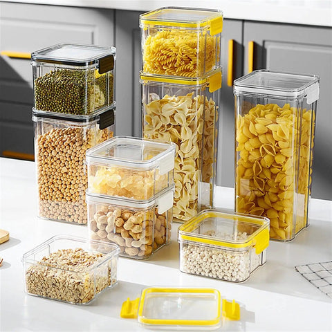 Straight Up Solid Game Changer For Your Kitchen Pantry Clear Airtight Glass Coffee Jar With Matching Spoon And Stand Sealed Food Container For Spices Or Grains stacked jars with yellow lids holding grains and pasta on a kitchen counter