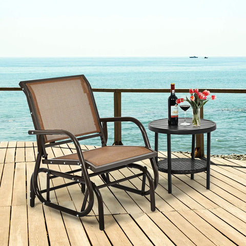 Cozy Brown Swing Glider Chair With Sturdy Metal Frame by the sea on a wooden deck with a side table and wine