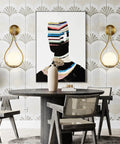 Modern dining room with Globe Glass Wall Sconce Set Of 2 Brushed Metal Modern Bathroom Light Fixtures on either side of artwork.