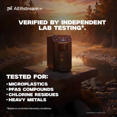 GW Pro Daily Water Factory Atmospheric Water Generator on outdoor table with lab test results at sunset