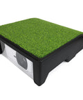 Golf Simulator Projector Cover With Turf Floor Mounted Enclosure showing HDPE Shield and grass-like top surface.