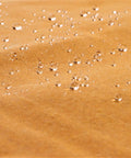 Close-up of water droplets on Heavy Duty 18 Oz Canvas Tarp Waterproof UV Resistant With Rustproof Grommets For Industrial And Commercial Use.