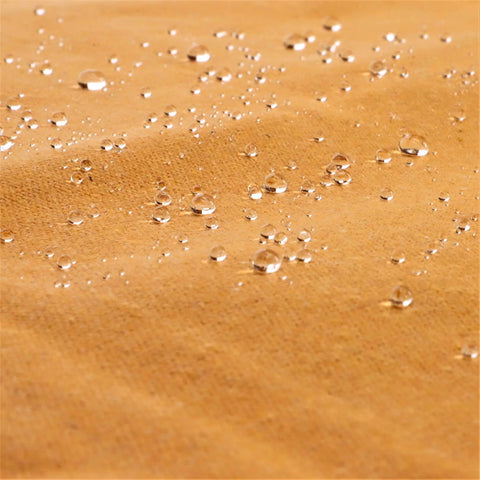 Close-up of water droplets on Heavy Duty 18 Oz Canvas Tarp Waterproof UV Resistant With Rustproof Grommets For Industrial And Commercial Use.