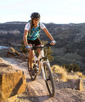 Cyclist riding mountain bike on trail, equipped with Beefy 26 Inch Bike Tubes 26x2.125 To 2.40 With AV32mm Schrader Valve
