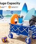 All Terrain Beach Wagon With Big 9 Inch Balloon Wheels For Sand And Grass 400 Lb Heavy Duty Collapsible Cart loaded with beach gear on sand