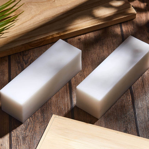 Two UHMW solid plastic blocks in white polyethylene, 7.9 x 2.4 x 2.4 inches, used as heavy duty tapping blocks for wood flooring