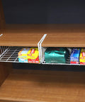 Hella Versatile Two Pack Under Shelf Wire Baskets White Metal Drop Down Organizers holding kitchen supplies in a cabinet.