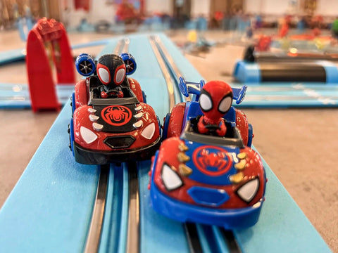 It's Spidey Time Slot Car Race Track Set With Spidey And Spin Cars racing on blue track
