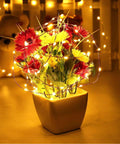 Fairy String Lights 33 Ft 100 LEDs Copper Wire Plug In Indoor Outdoor With 8 Lighting Modes And Memory Function For Bedroom Parties Weddings Christmas Decor wrapped around flower arrangement in vase