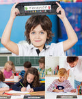 Student holding 48 Desk Name Tags Classroom Set With Traditional Manuscript Nametags Self Adhesive Alphabet Number Line Ruler Addition Chart.