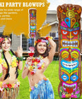 Colorful 5 ft inflatable tiki decoration with built-in LED lights beside people in Hawaiian attire for outdoor luau party.