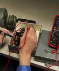 MM525 True RMS 6000 Count Digital Multimeter With NIST Calibration in use during motor voltage testing