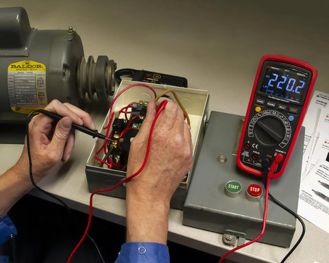 MM525 True RMS 6000 Count Digital Multimeter With NIST Calibration in use during motor voltage testing