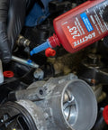 Applying Medium Strength Surface Insensitive Threadlocker For 1/4 To 3/4 Inch Fasteners on automotive engine bolt