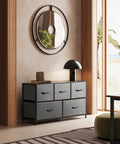 Five Drawer Fabric Dresser For Bedroom And Closet Storage, dark grey wide chest with fabric bins in stylish living room setting.
