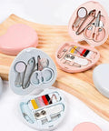 Compact Travel Sewing Kit Two Pack Featuring Adorable Heart Shaped Cases Pink And Blue with scissors, threads, and pins.
