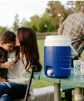 2 Gallon Portable Sports Cooler Water Beverage Dispenser Insulated Cooler With Spigot And Swing Up Handle For Easy Carry Cool Riser Technology Improves Cooling On The Go Majestic Blue on picnic table
