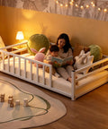 Toddler Floor Bed With Rails And Door, Montessori Low Profile Metal Platform Bed For 2 to 5 Years Old in a cozy room setting
